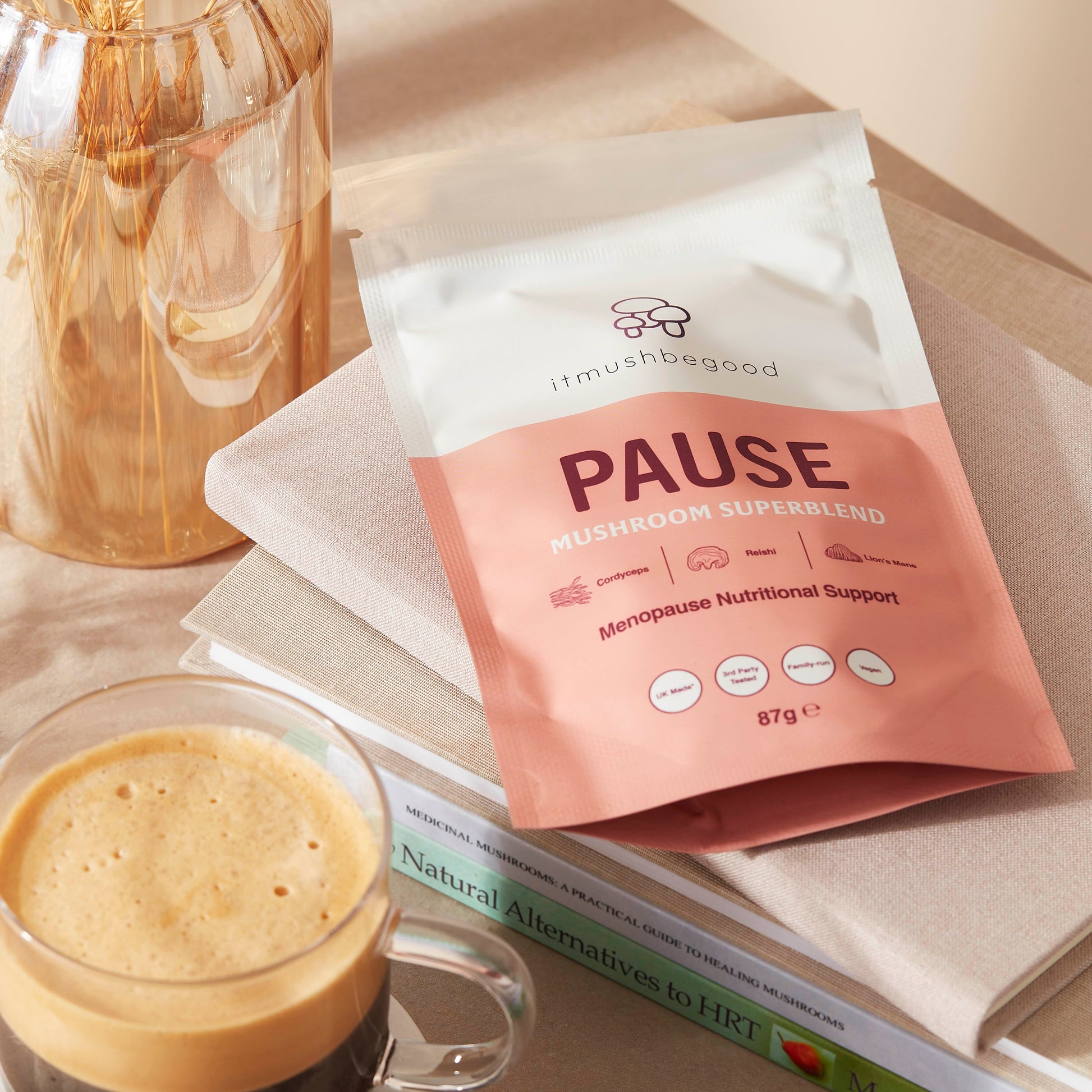 Pause Sachet with Menopause self help book with a coffee