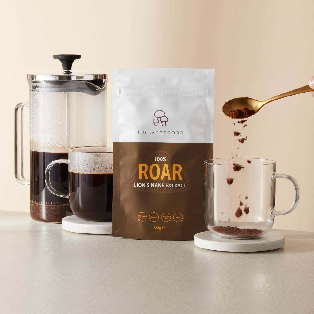 Lions Mane supplement sachet next to coffee cups and cafetiere 