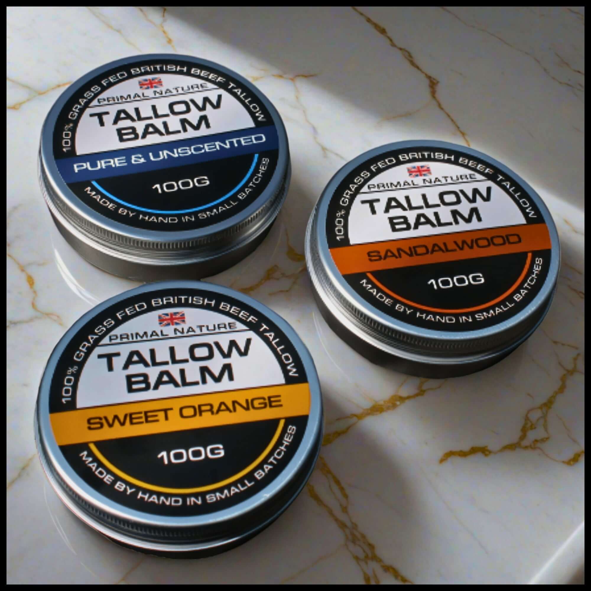 Tallow Skincare Bundle featuring Pure & Unscented, Sandalwood, and Sweet Orange tallow balms on a marble surface.