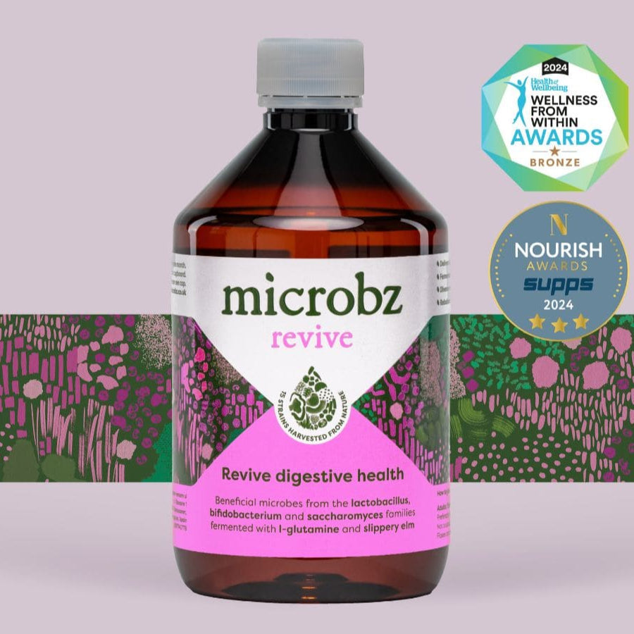 A picture of a bottle of microbz revive probiotic supplement with two award logos